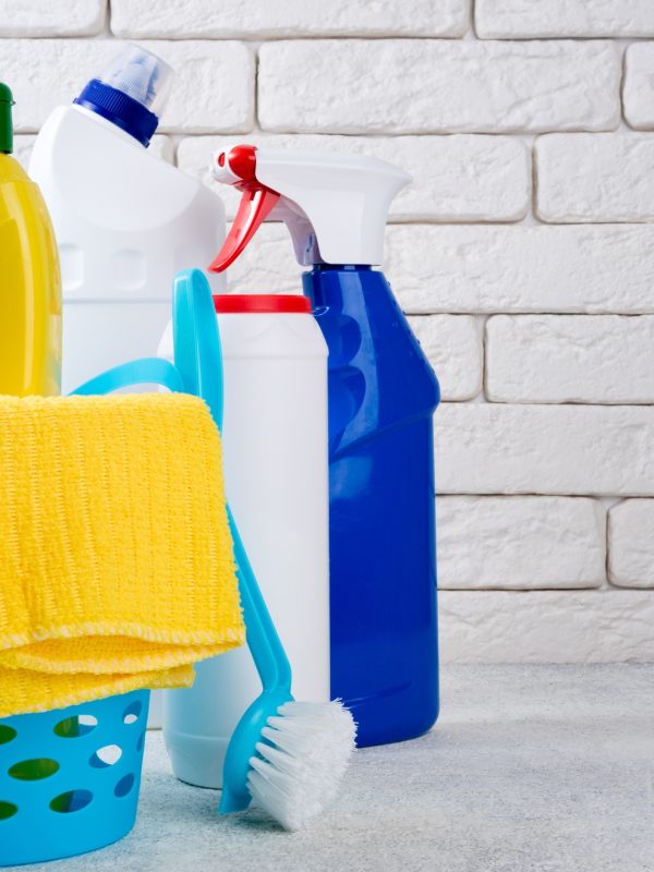 Cleaning background. Basket with cleaning products. Cleaning with supplies, service and clean house Cleaning background. Basket with cleaning products. Cleaning with supplies, service and clean house